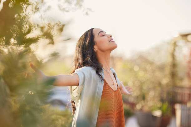 Woman feeling lighter and refreshed outdoors