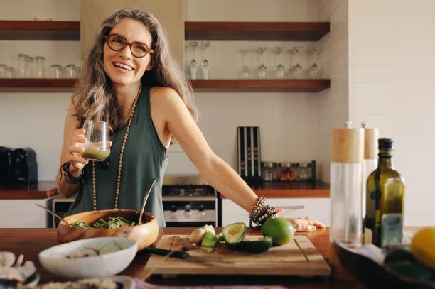 Woman enjoying a healthy lifestyle in her kitchen